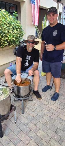 Police-OffIicer-Anthony-Pruchnik-and-his-father-Father-Bill-heating-up-the-Chili