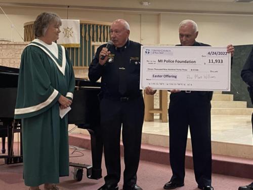 United Church Thank you Michelle Hennessy presnting check to MIPF President Vernon Geberth and Director Bill Miller