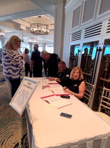 Laura-Geberth-at-Registration-Table-with-Director-Al-Benarrochand-Bill-Young-Photo-by-Geberth