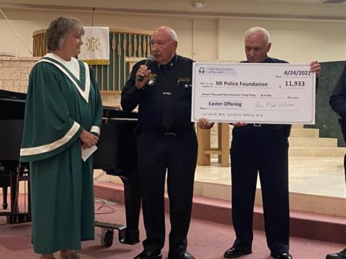 On Sunday, April 24, 2022 Police Officer Bill Miller, Second VP of the Marco Police Foundation and Vernon Geberth President of the Marco Police Foundation appeared at the United Church of Marco to accept a generous donation from Missions Committee and congregants of the United Church.Pastor Reverend Dr. Mark Williams introduced Mrs. Michelle Hennessy, who is the Chair of the Missions Committee to present this donation to President Vernon Geberth and Officer Bill Miller for the Foundation. The actual total donation after collection was $16,355.00.